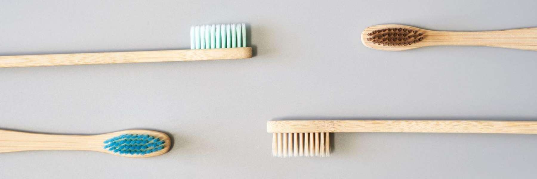 Four wooden toothbrushes