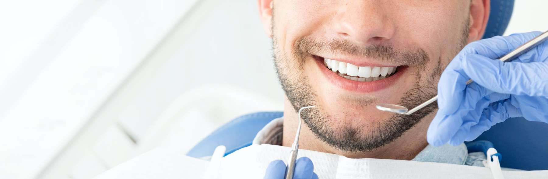 A man getting a dental exam in Scottsdale